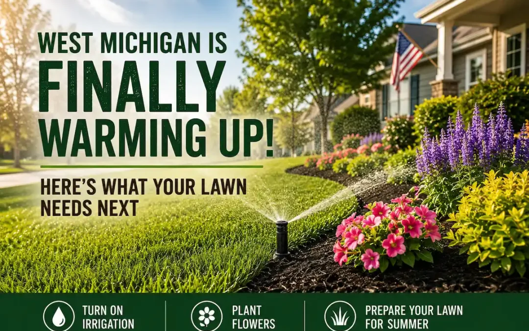 Beautiful suburban lawn with irrigation sprinkler and colorful flower beds in Caledonia Michigan